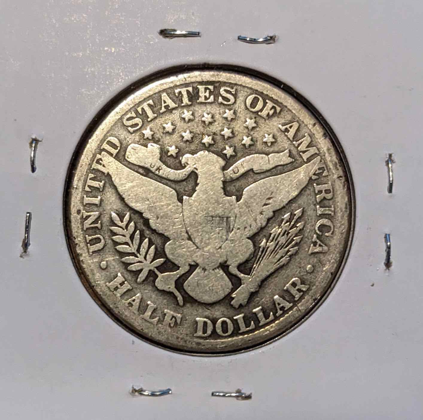 1902 Barber Half Dollar coin with intricate design, 90% silver, historical collectible.