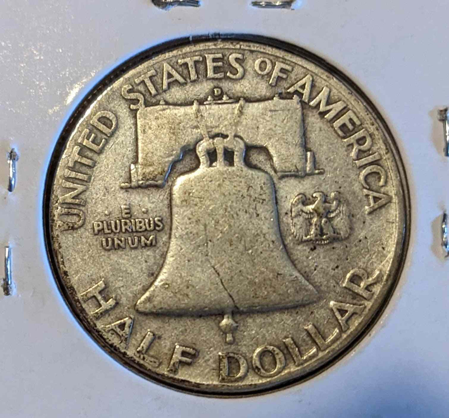 1949 D Franklin Half Dollar with Liberty Bell design, valuable collector's coin.