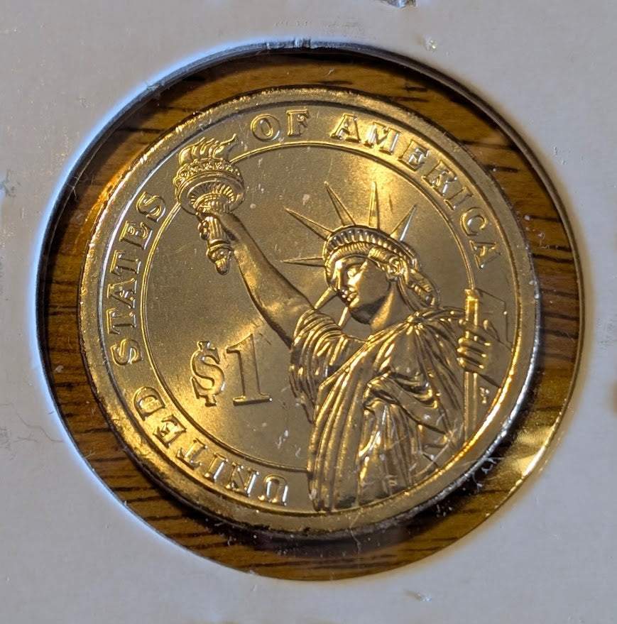 2008 John Quincy Adams Presidential Uncirculated Dollar Coin in mint condition.