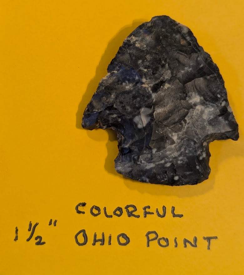 1.5-inch colorful Ohio Native American projectile point made of mottled flint/chert with notched edges and broad triangular shape