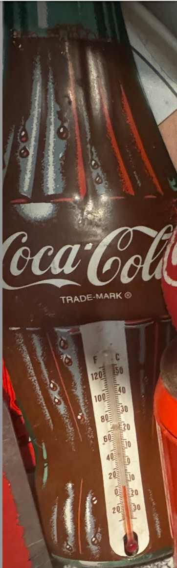 Vintage Coca-Cola bottle thermometer with embossed trade-mark design on wooden wall plaque