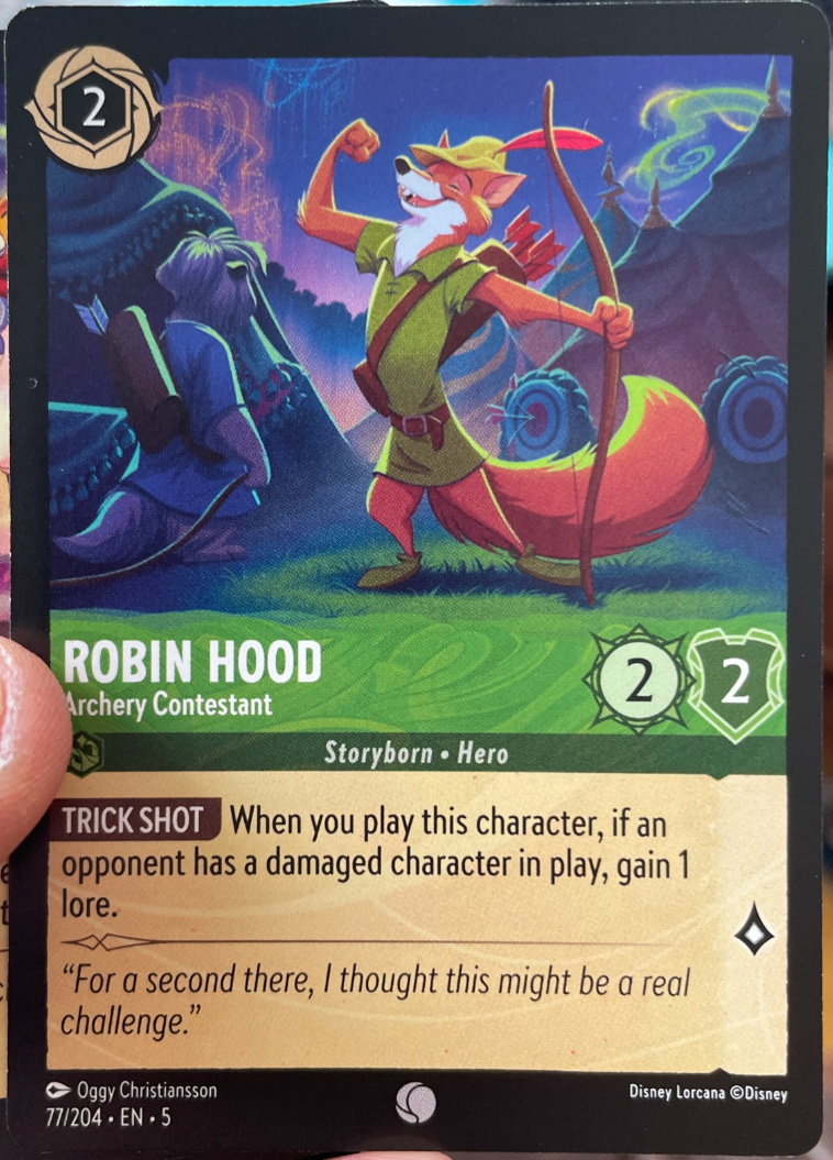 Disney Lorcana Robin Hood – Archery Contestant card featuring Emerald Storyborn Hero with archery theme and Trick Shot ability