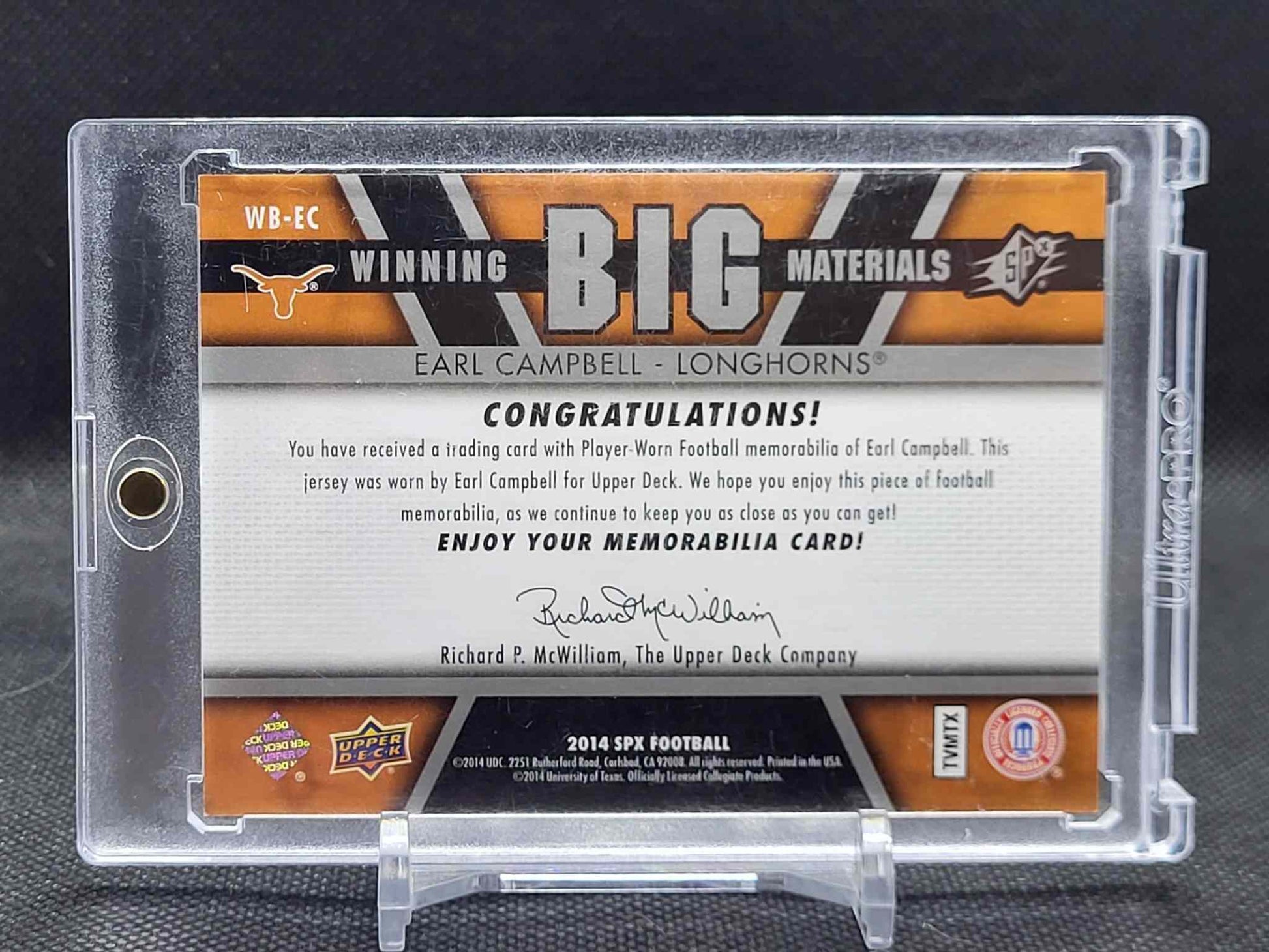 2014 SPx #WB-EC Earl Campbell Winning Big Materials football memorabilia card in plastic case.