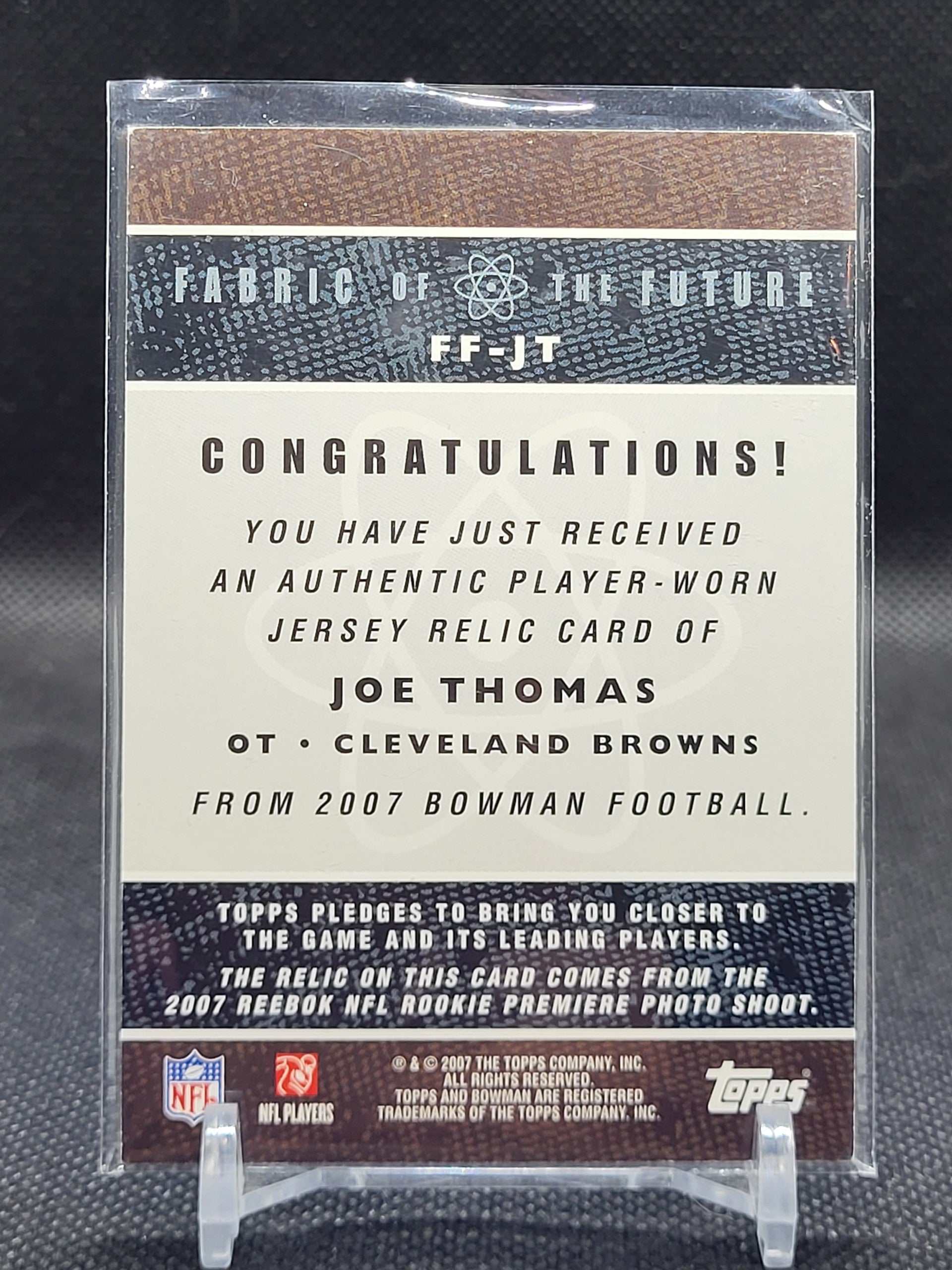 2007 Bowman Orange #FF-JT Joe Thomas Fabric of the Future card featuring player-worn jersey.