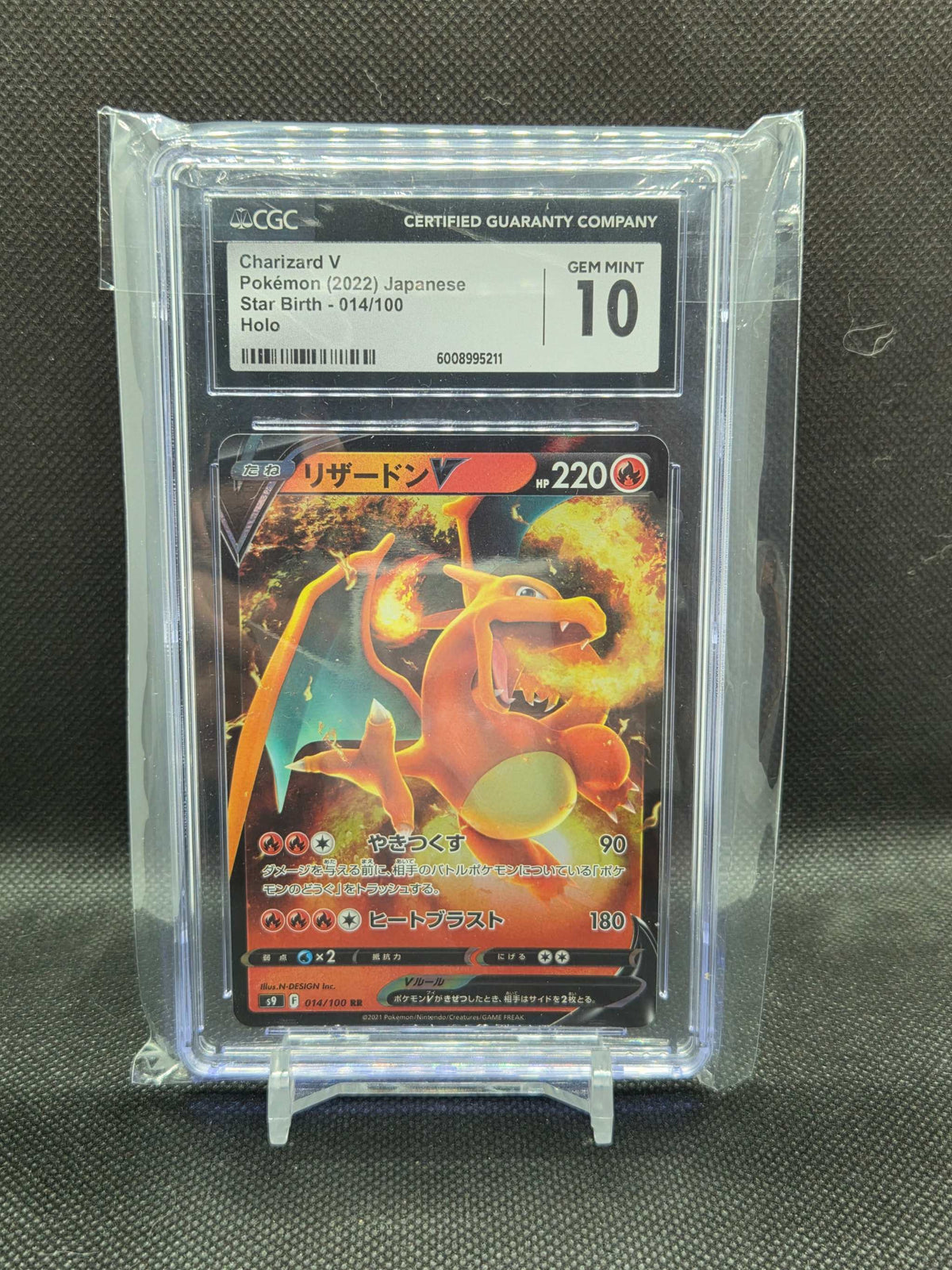 2022 Pokémon Japanese Charizard V holo trading card, red and orange with fiery artwork, graded CGC 10 GEM MINT in a clear protective case