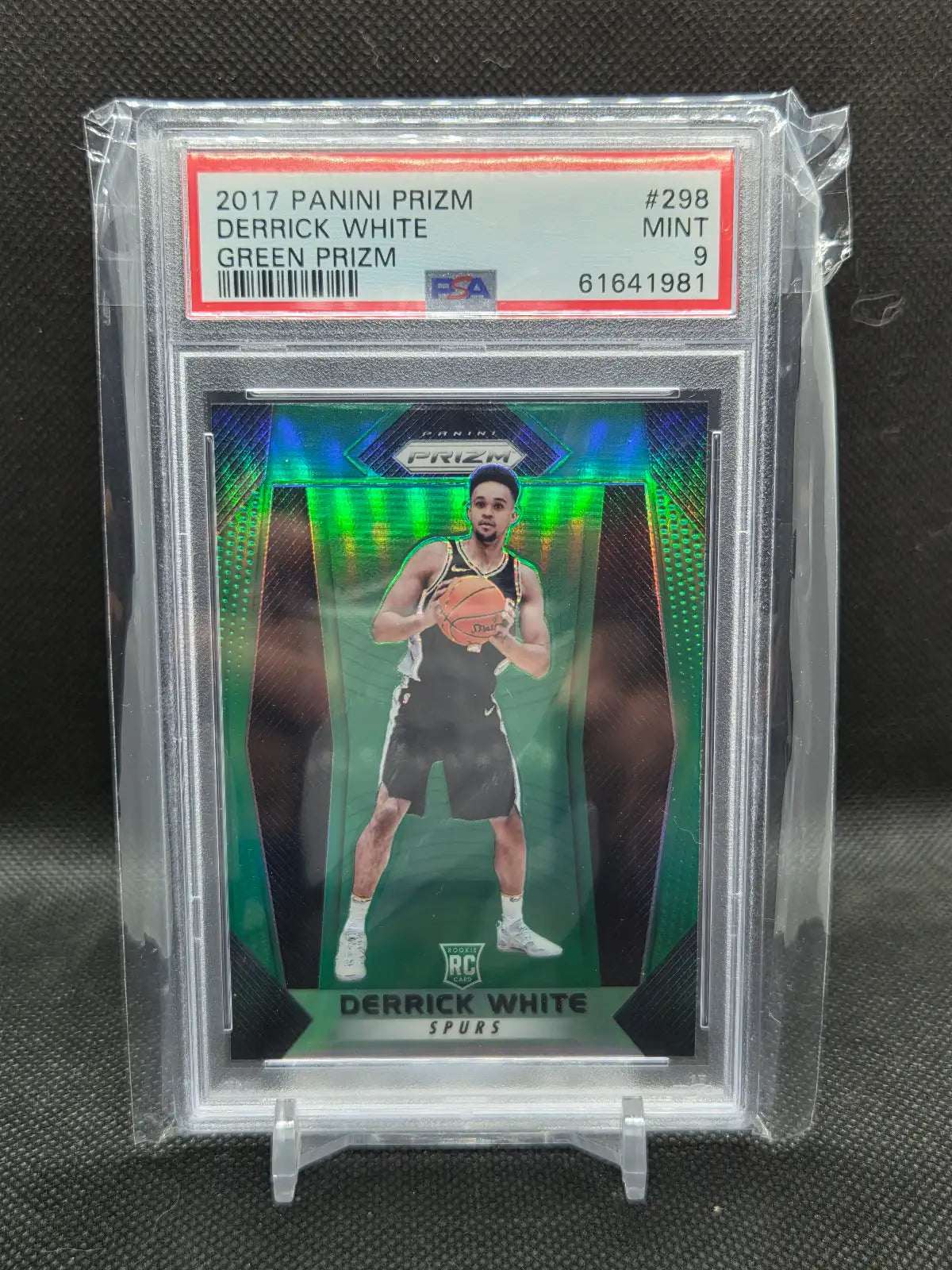 2017-18 Panini Prizm Derrick White rookie basketball card, green reflective Prizm finish in a PSA 9 holder.