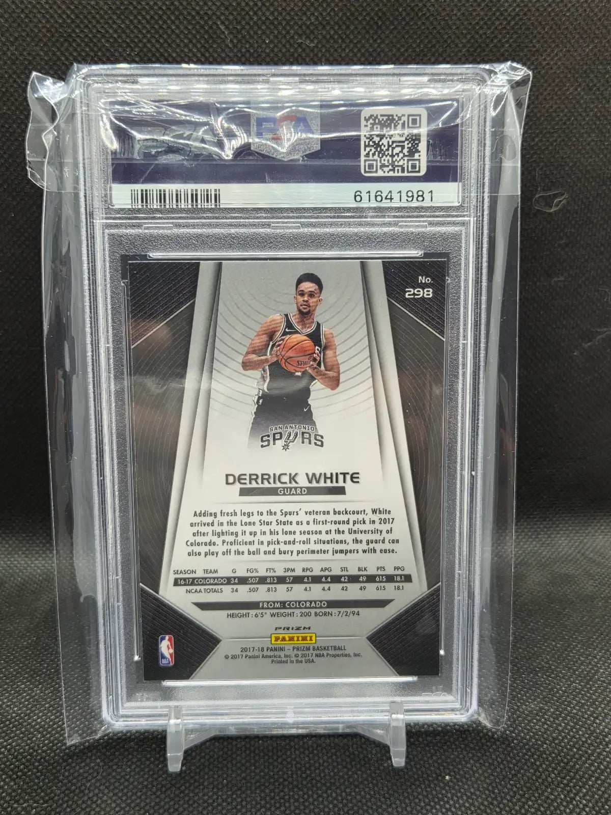 Back of 2017-18 Panini Prizm Derrick White Green Prizm rookie card #298 showing the card back and San Antonio Spurs team details, in the PSA holder