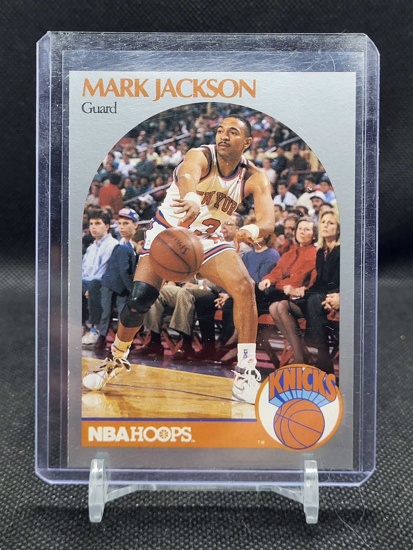 1990 NBA Hoops Mark Jackson card with Menendez Brothers in background.