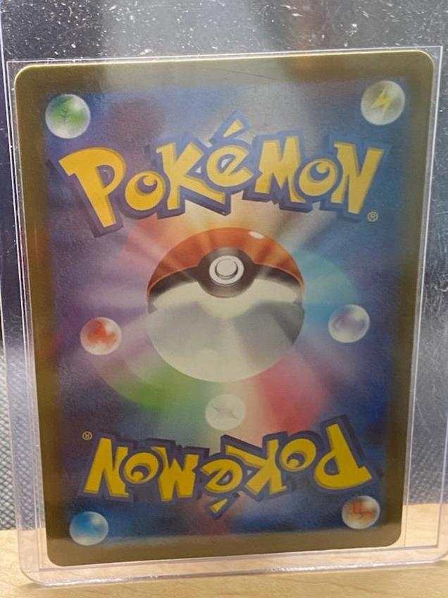Crocalor 79/73 Japanese Triple Beat Pokémon card in protective sleeve.