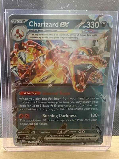 CHARIZARD ex 125/197 Obsidian Flames Pokémon card in mint condition with fiery design.