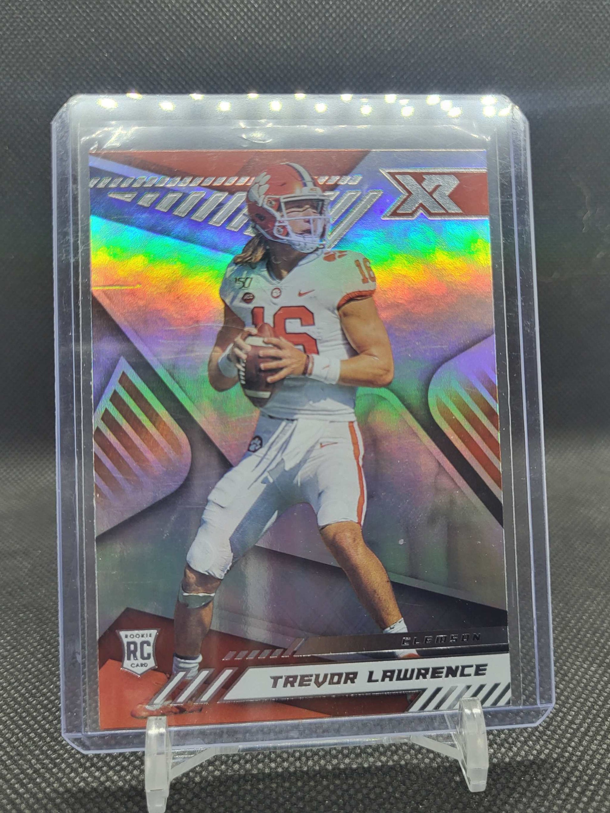 2021 Panini Chronicles Draft Picks XR Trevor Lawrence Rookie Card #179 Clemson Tigers with chromium finish and vibrant geometric design