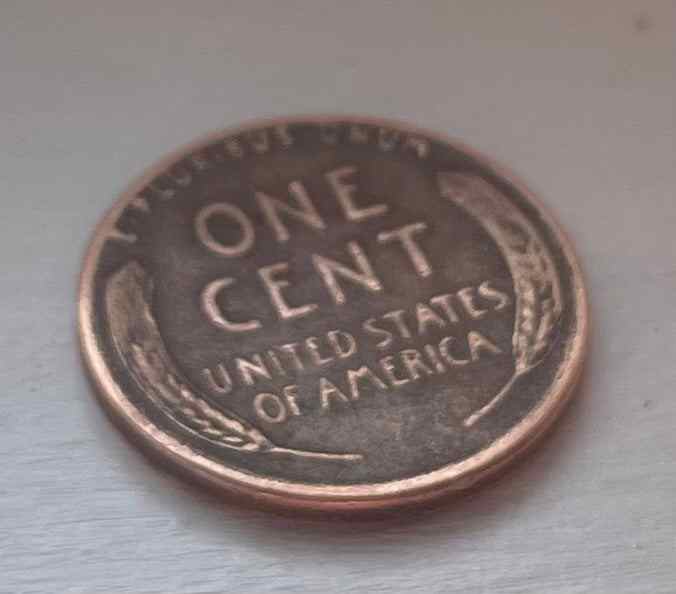 Beautiful 1955 wheat penny, Lincoln silhouette, Rarity Rack auction, coin collectible.