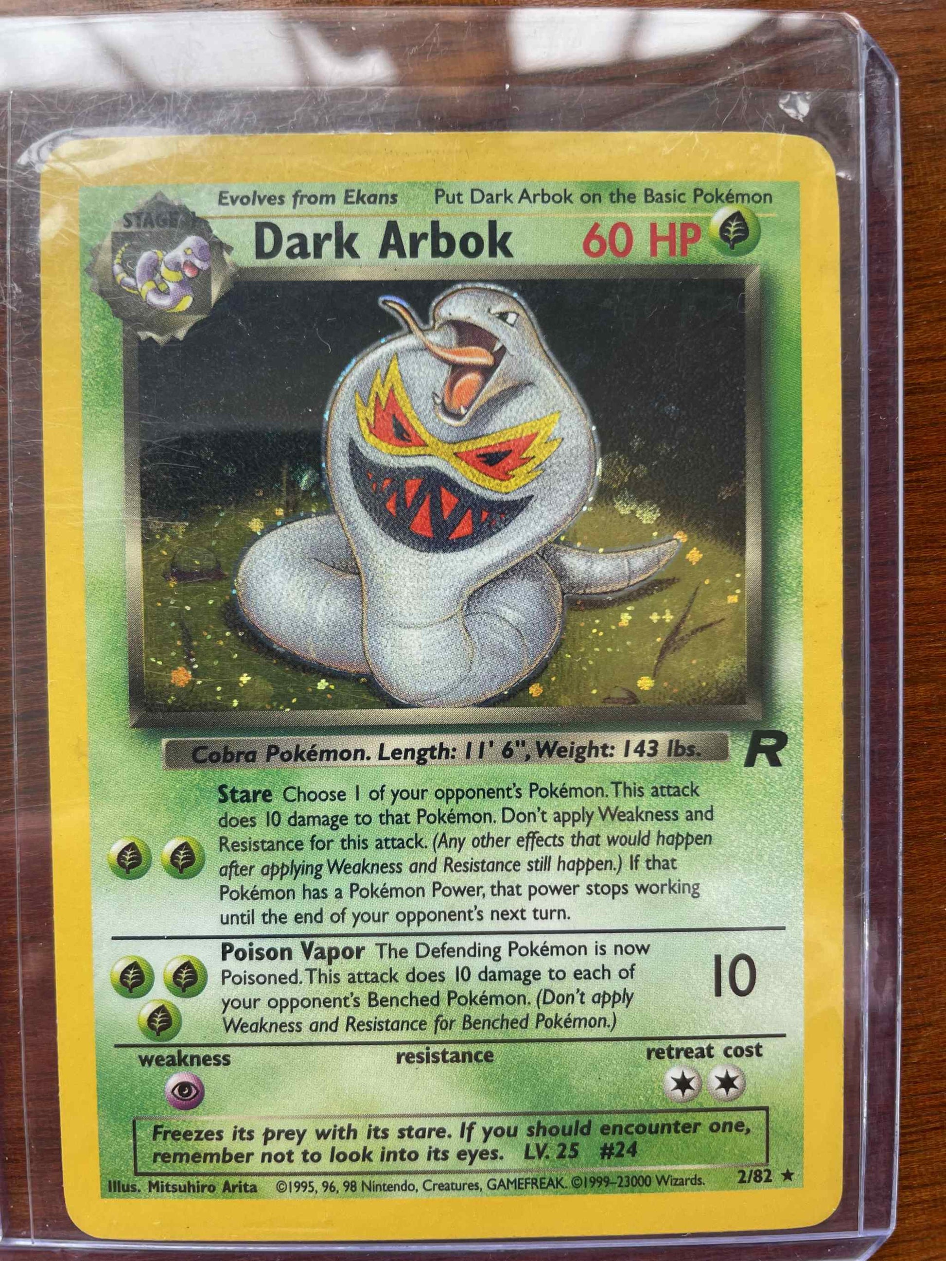 Team Rocket Dark Arbok #2/82 Pokémon card, showcasing unique design and abilities.