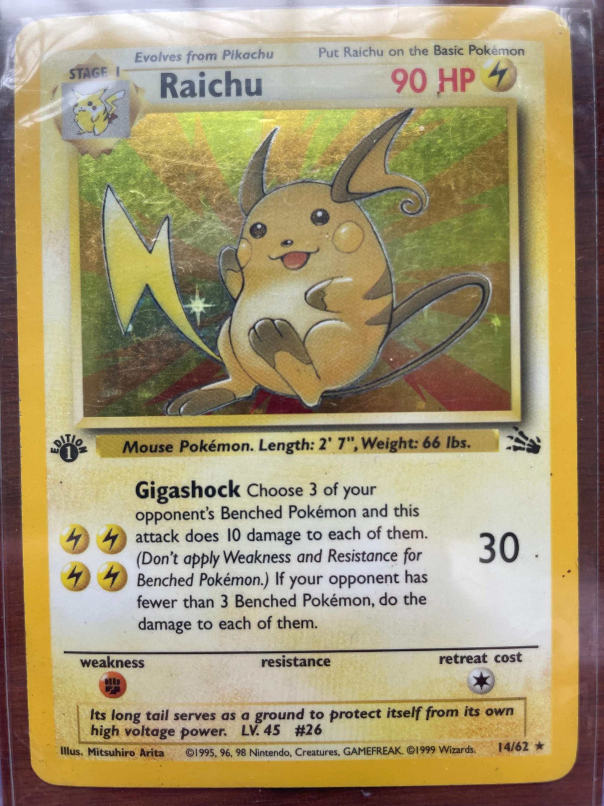 Fossil #14/62 Raichu Pokémon card, rare collectible.
