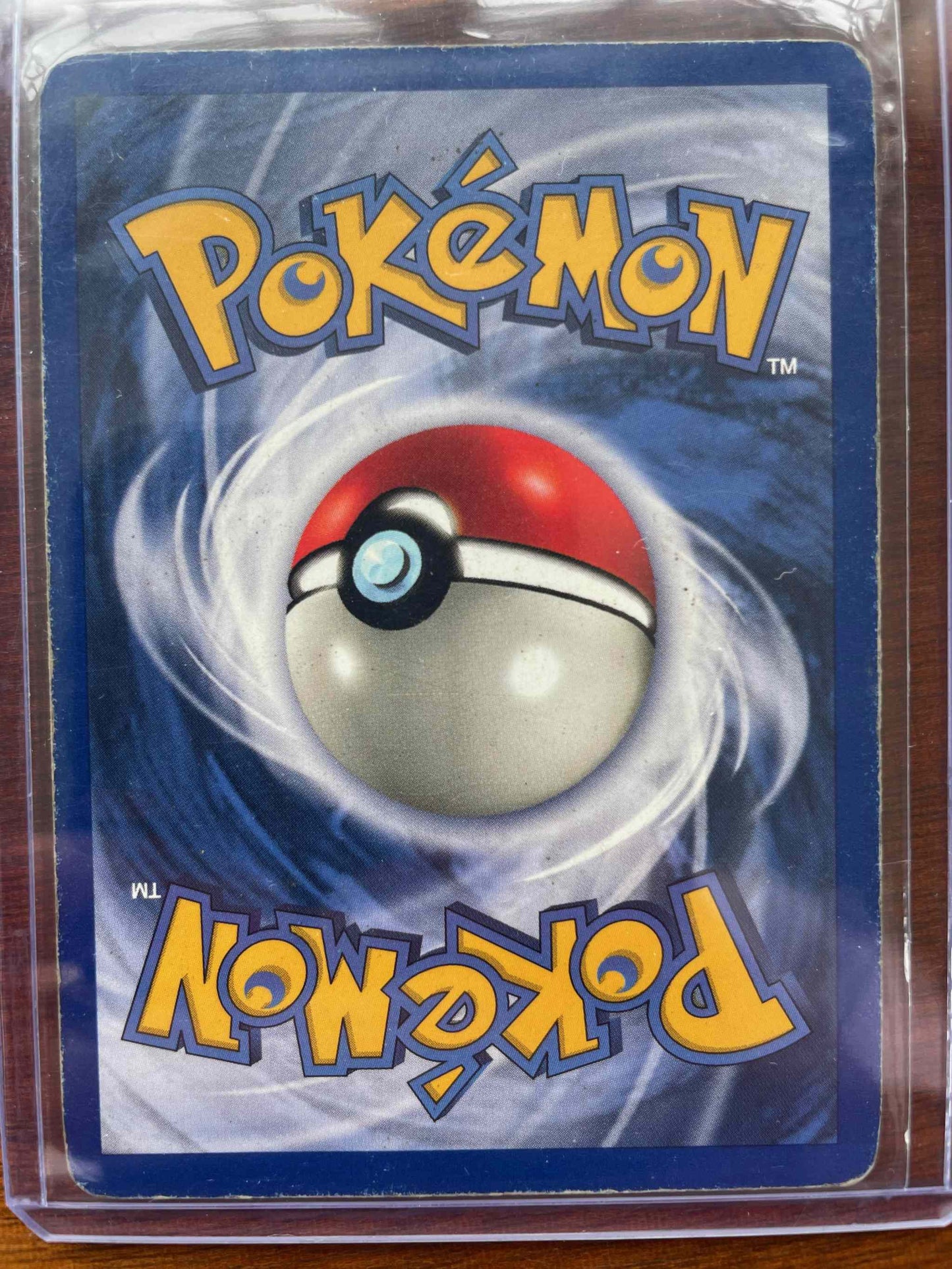 Jungle #11/64 Snorlax Pokemon card in protective sleeve.