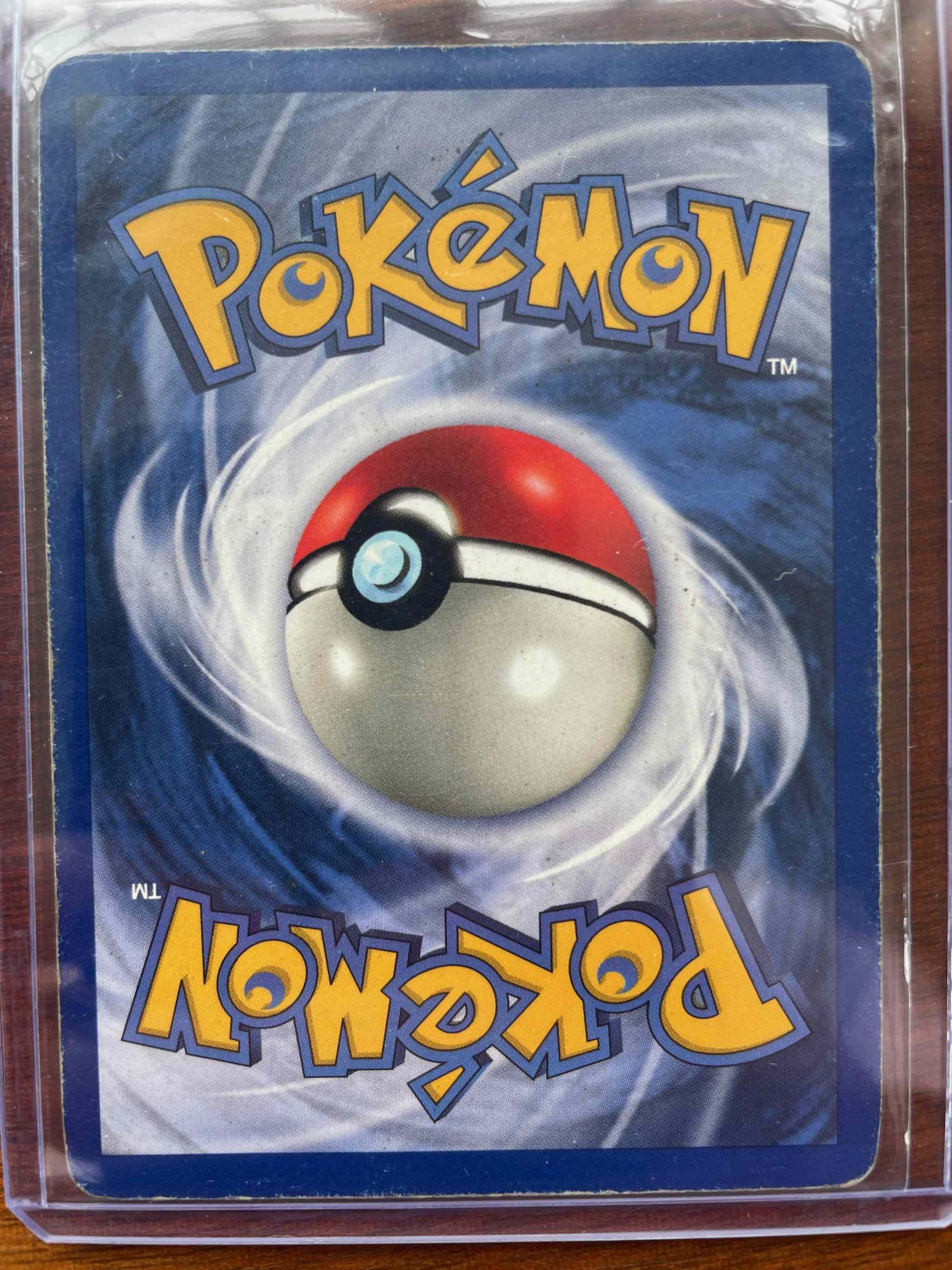 Jungle #11/64 Snorlax Pokemon card in protective sleeve.