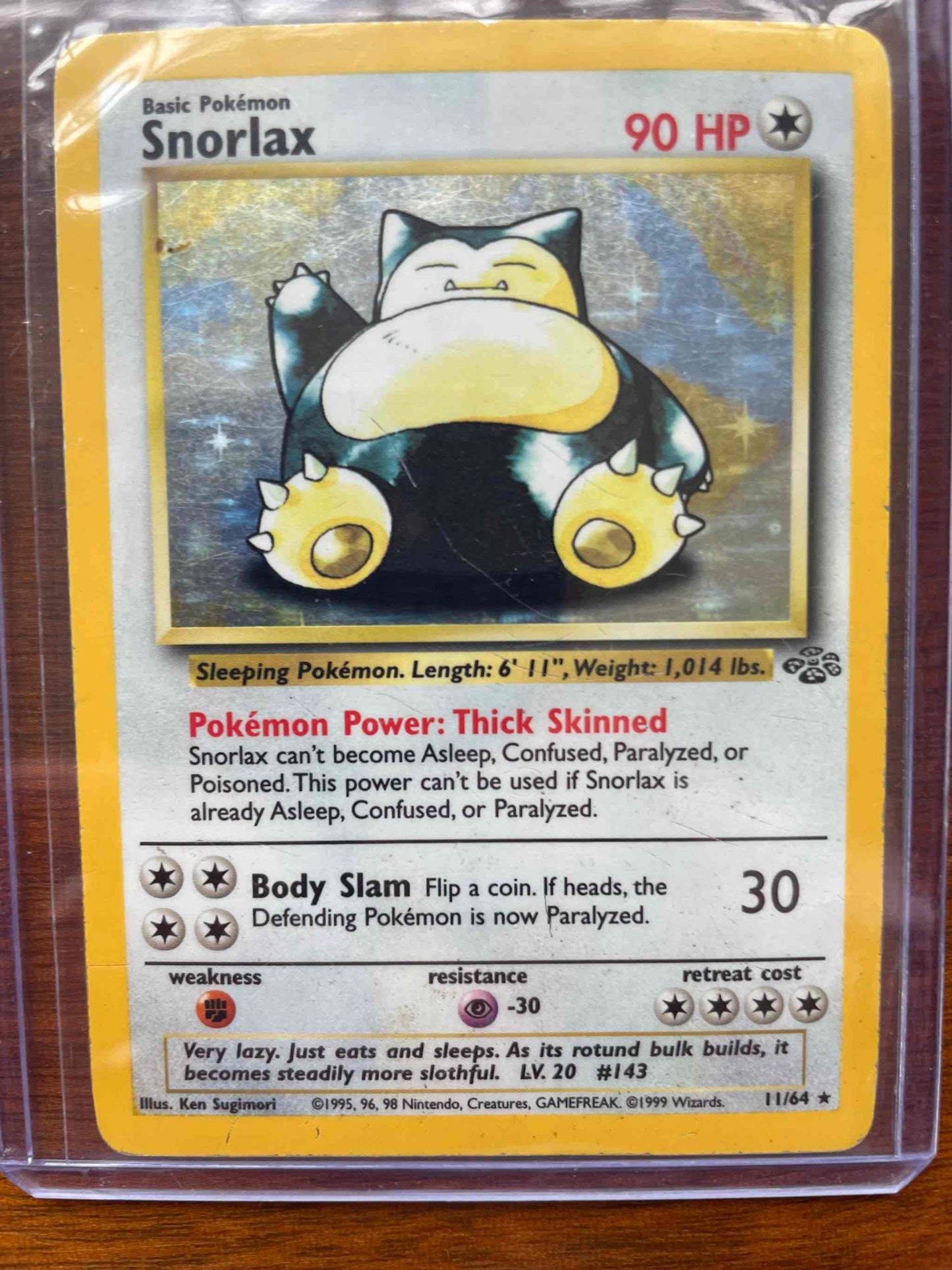 Jungle #11/64 Snorlax Pokémon card with 90 HP and Body Slam attack.