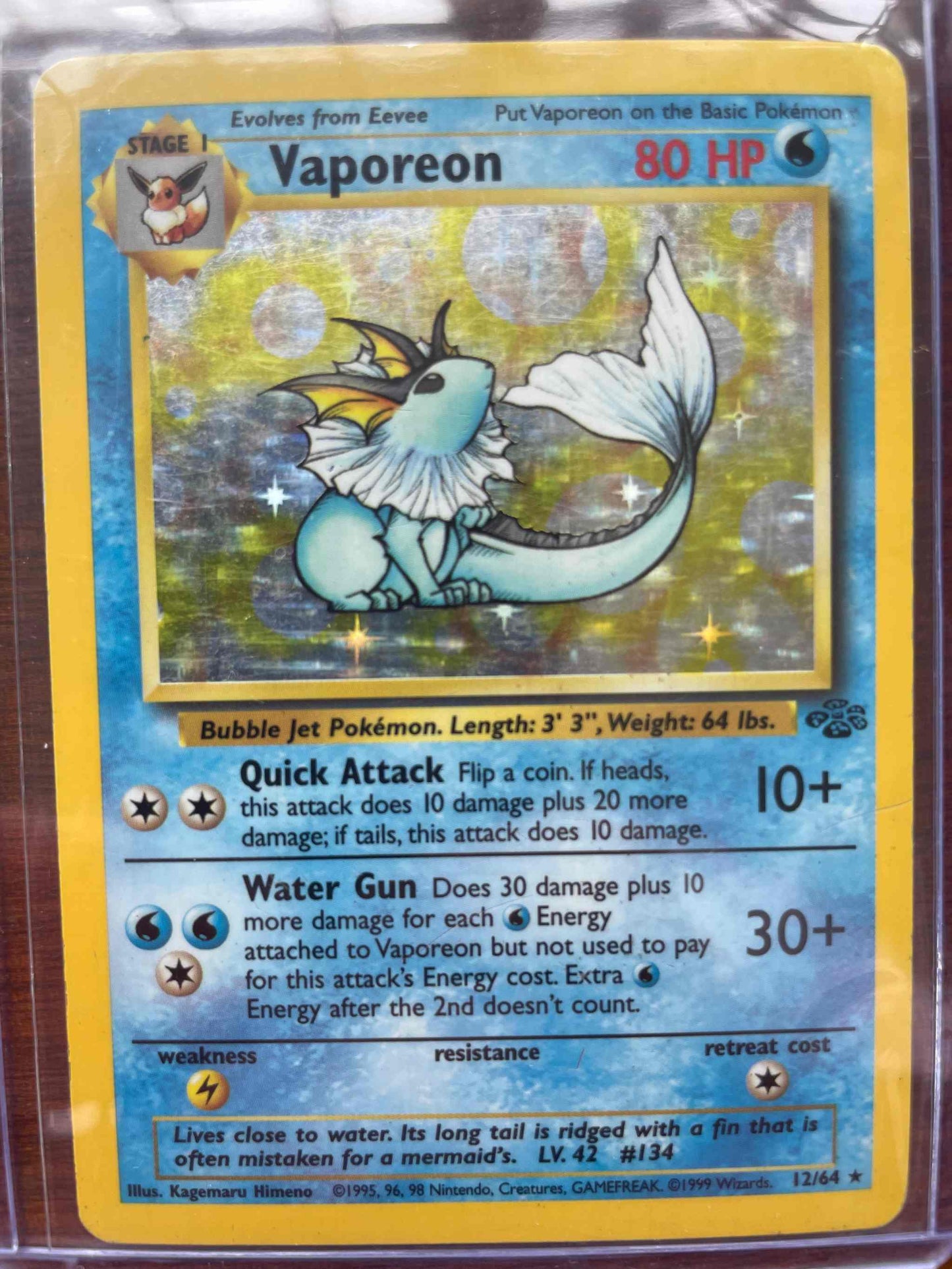 Jungle #12/64 Vaporeon Pokémon card, rare collector's item.
