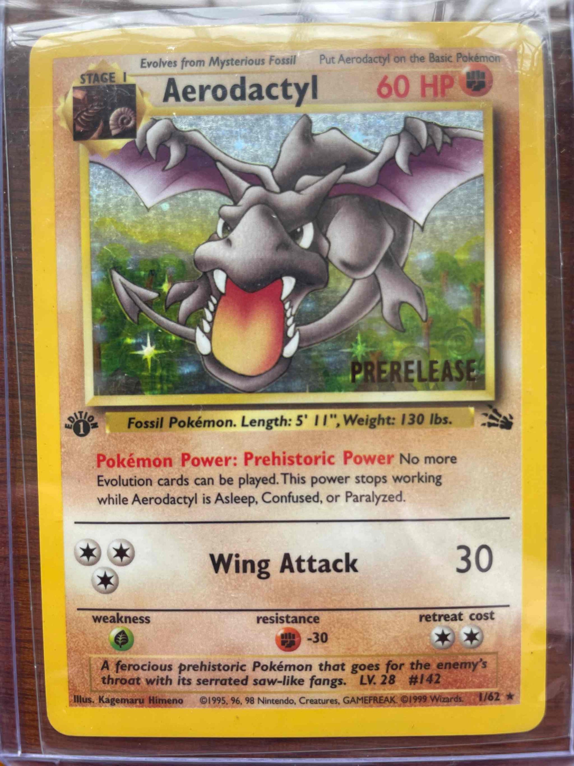 Rare Fossil #1/62 Aerodactyl trading card with detailed illustration.
