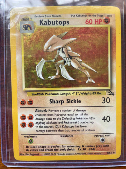 Fossil #09/62 Kabutops collectible Pokemon card in protective sleeve.