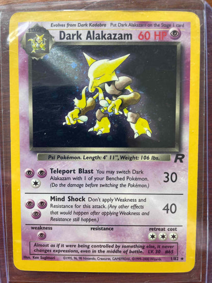 Team Rocket Dark Alakazam #1/82 trading card with unique design and rare appearance.