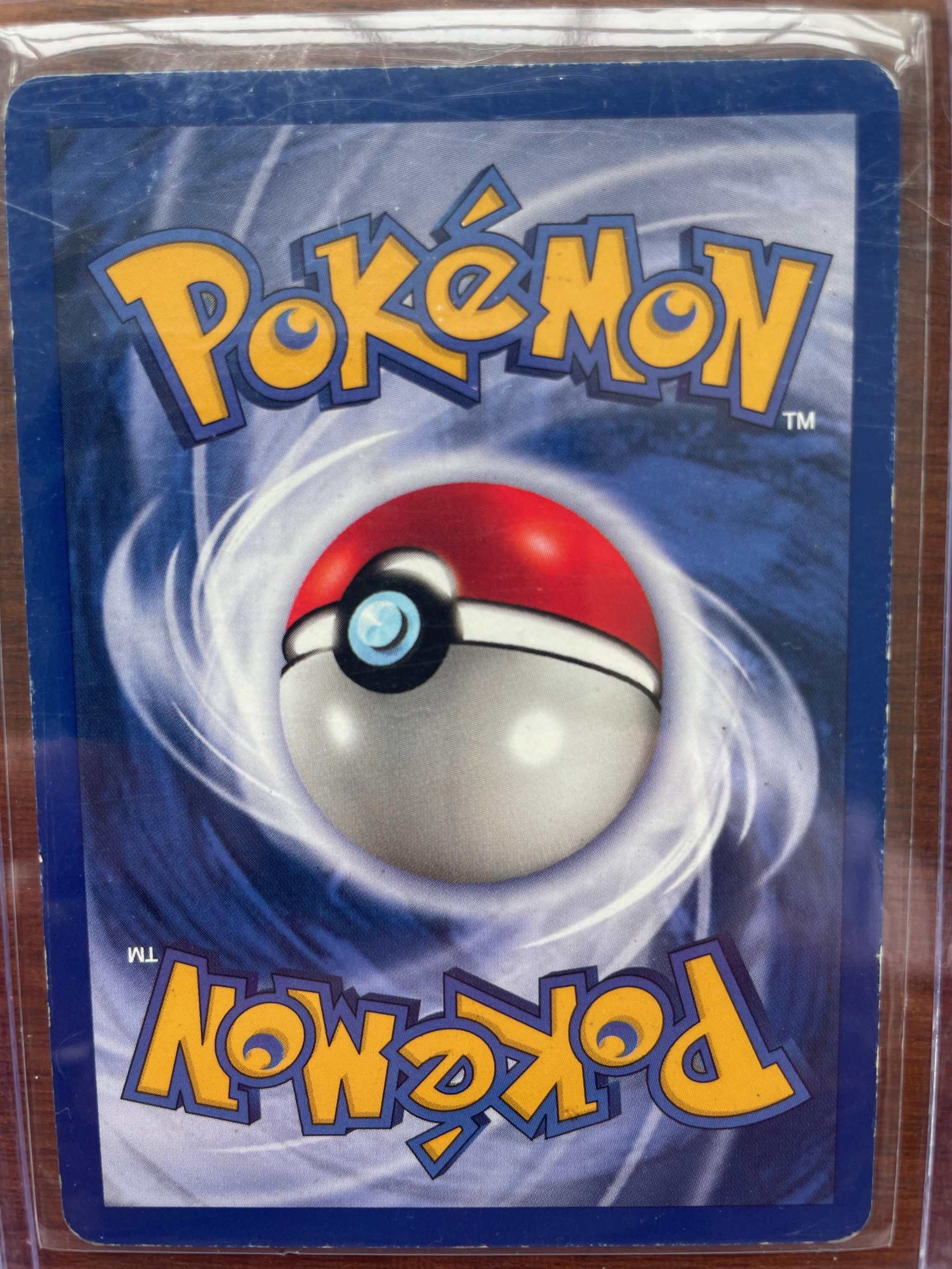 Fossil #02/62 Articuno Pokemon card in protective sleeve.
