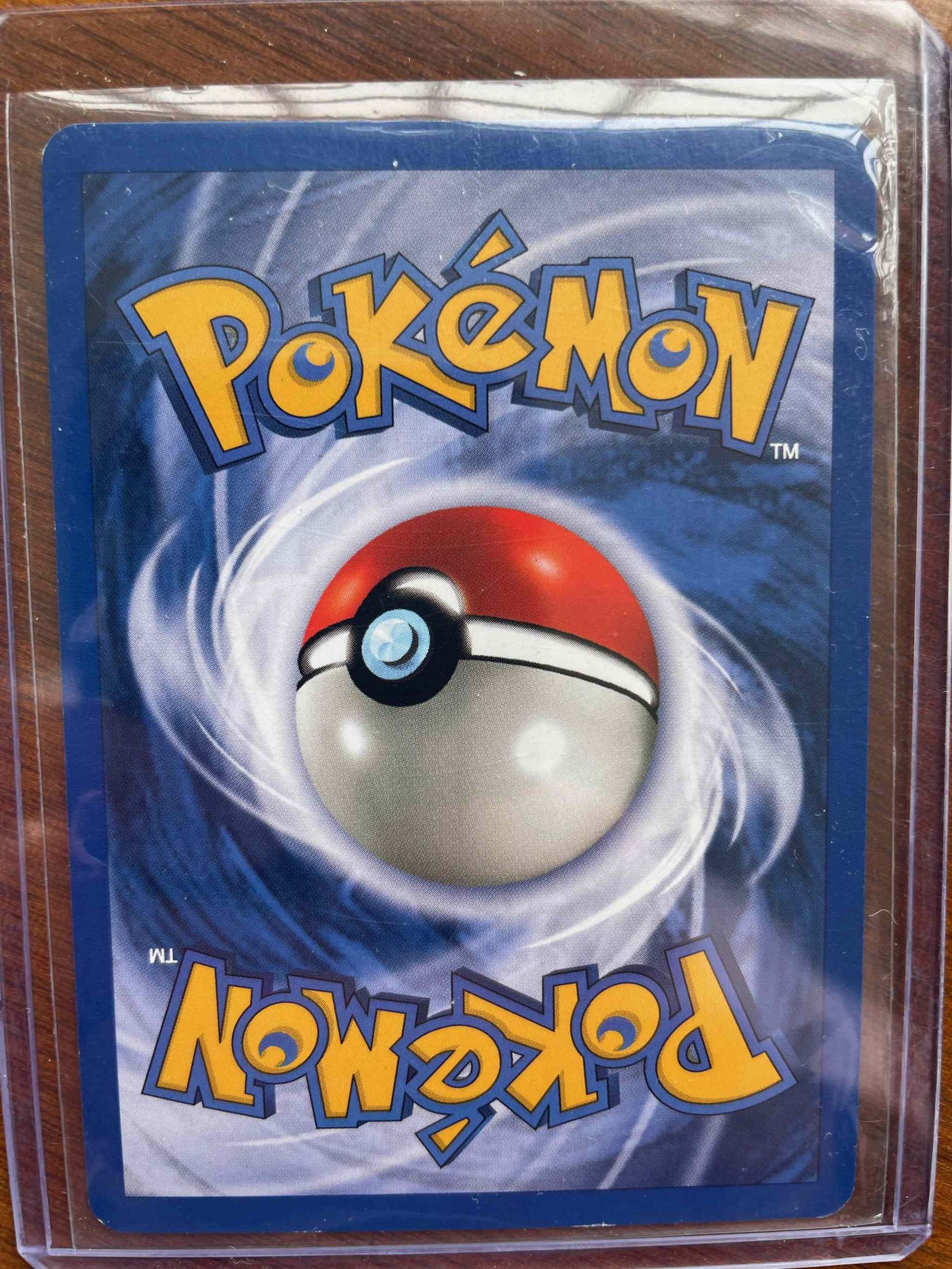 Base Set #009/130 Magneton Pokémon card in protective sleeve.