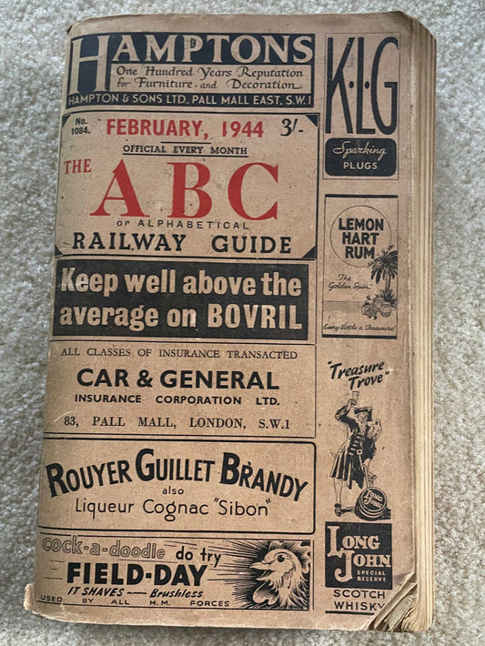 The ABC or Alphabetical Railway Guide February 1944 cover showing historic railway schedules and WWII-era advertisements.