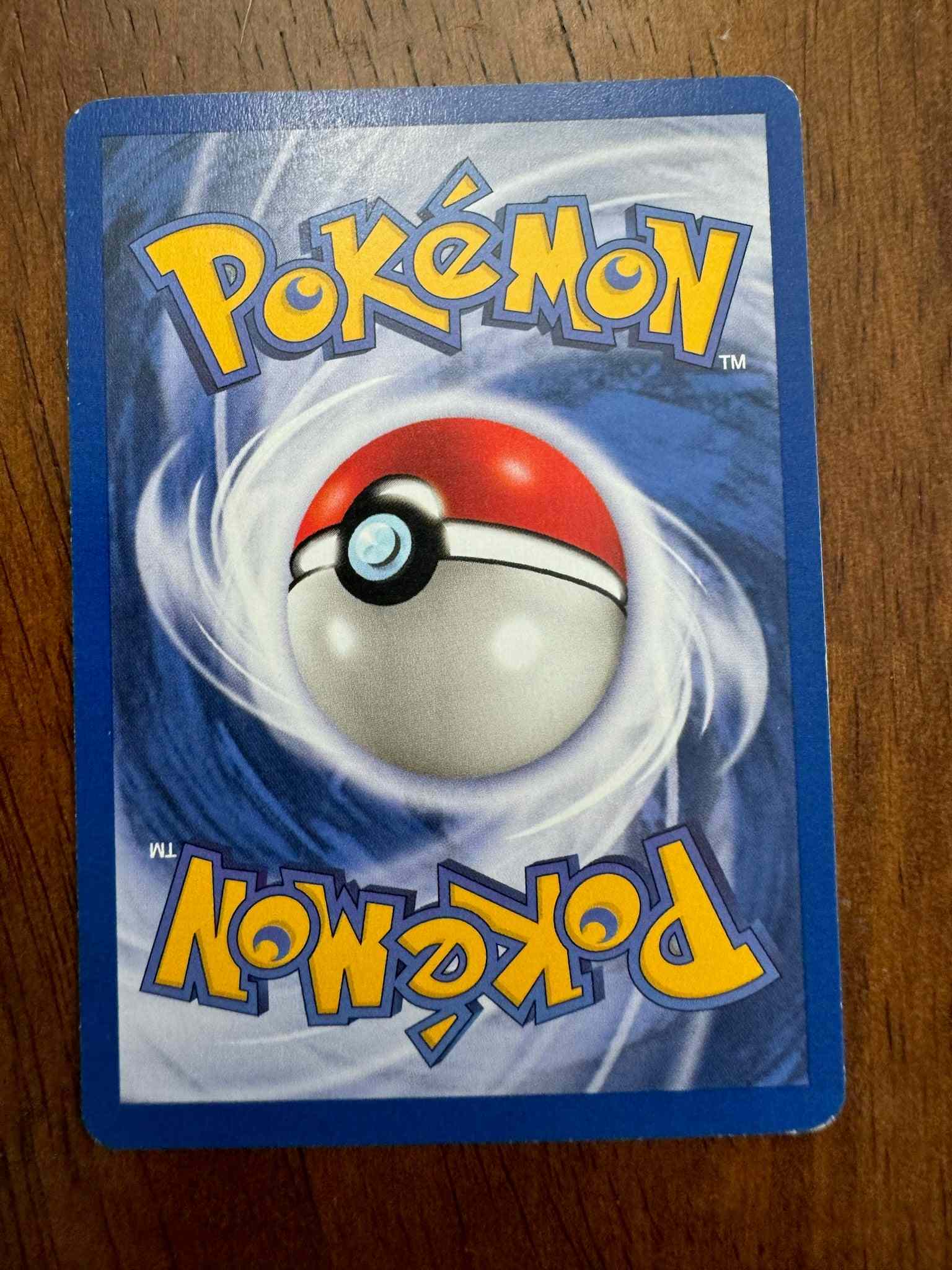 Team Rocket #61/82 Mankey Pokémon card featuring intricate artwork.