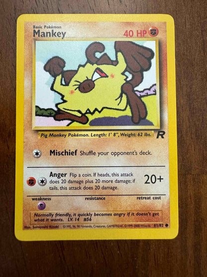 Team Rocket #61/82 Mankey Pokémon card with intricate artwork.