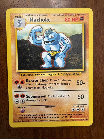 Base Set #034/102 Machoke Pokemon card showcasing Fighting-type abilities.