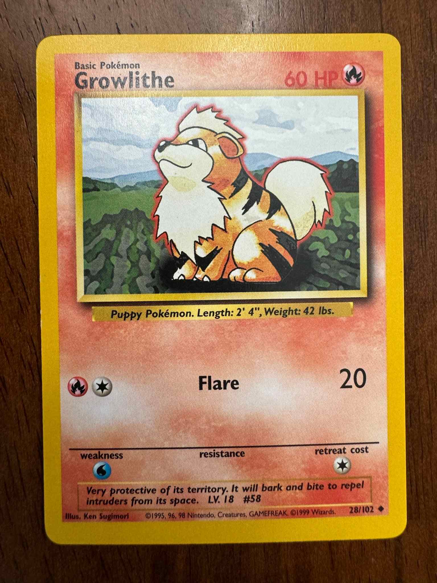 Base Set #028/102 Growlithe Pokémon card collectible.
