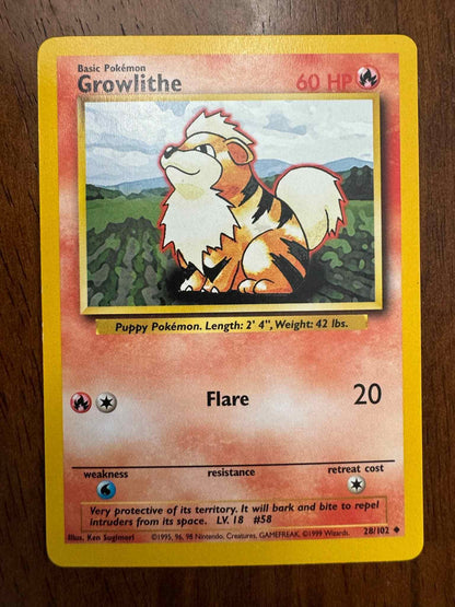 Base Set #028/102 Growlithe Pokémon card collectible.