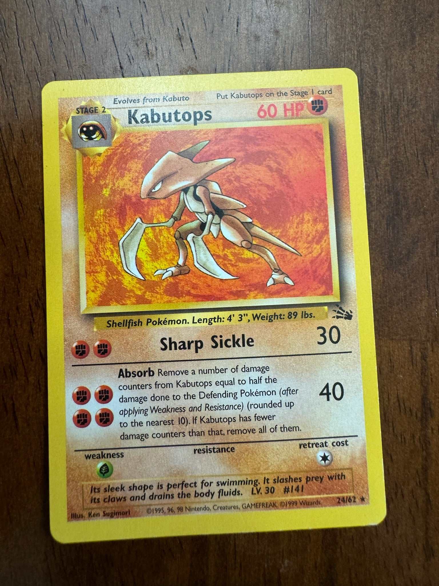 Fossil 2462 Kabutops 24 Pokemon card with unique design and abilities.