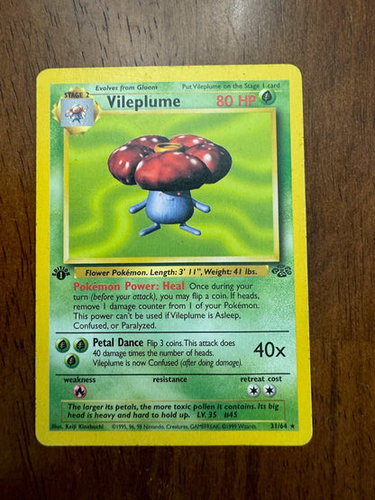 Jungle #31/64 Vileplume (31) Pokemon card on wooden surface displaying artwork and stats.