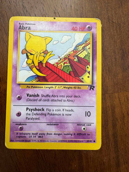 Team Rocket #49/82 Abra collectible card from Team Rocket set.