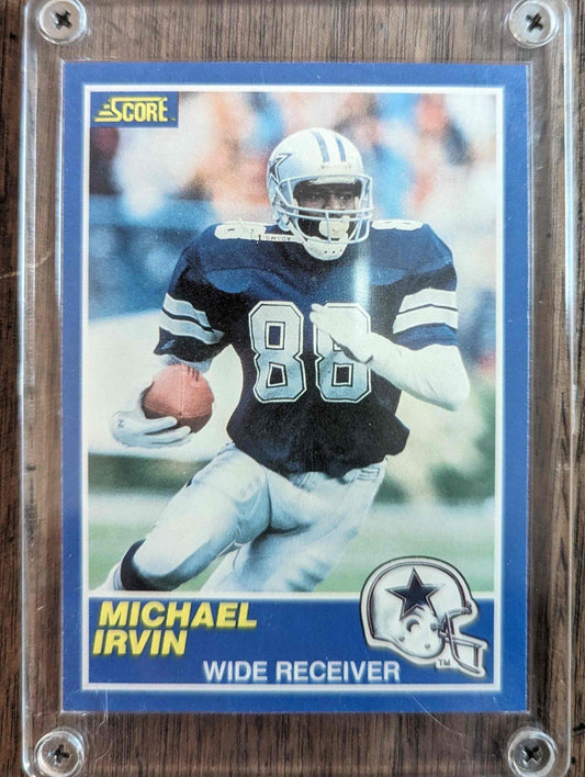 1989 Score #18 Michael Irvin rookie card in protective case featuring Dallas Cowboys wide receiver.