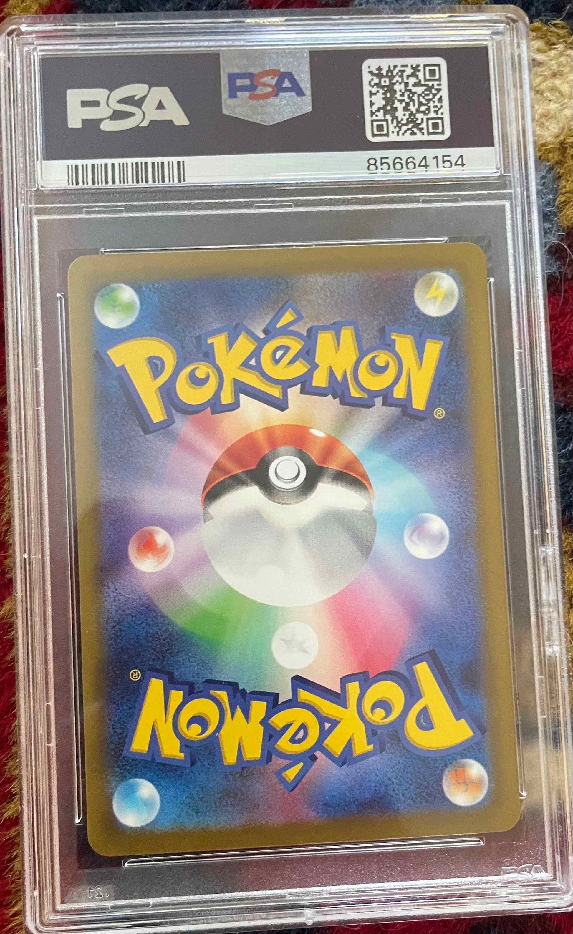PSA graded Japanese Charizard card from Paldean Fates #349/190 in mint condition.
