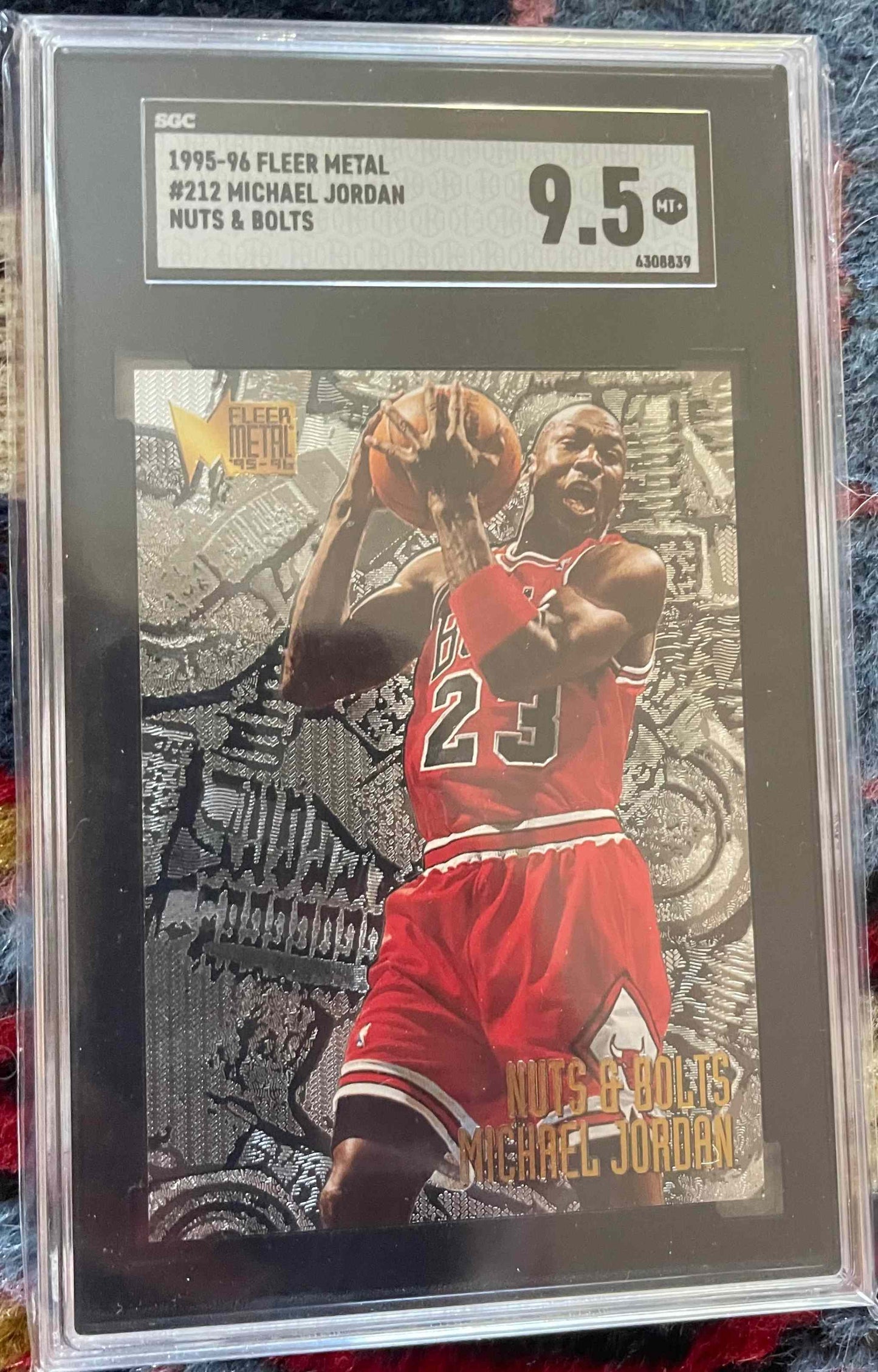 Michael Jordan 1995-96 Fleer Metal #212 Nuts & Bolts SGC 9.5 card.