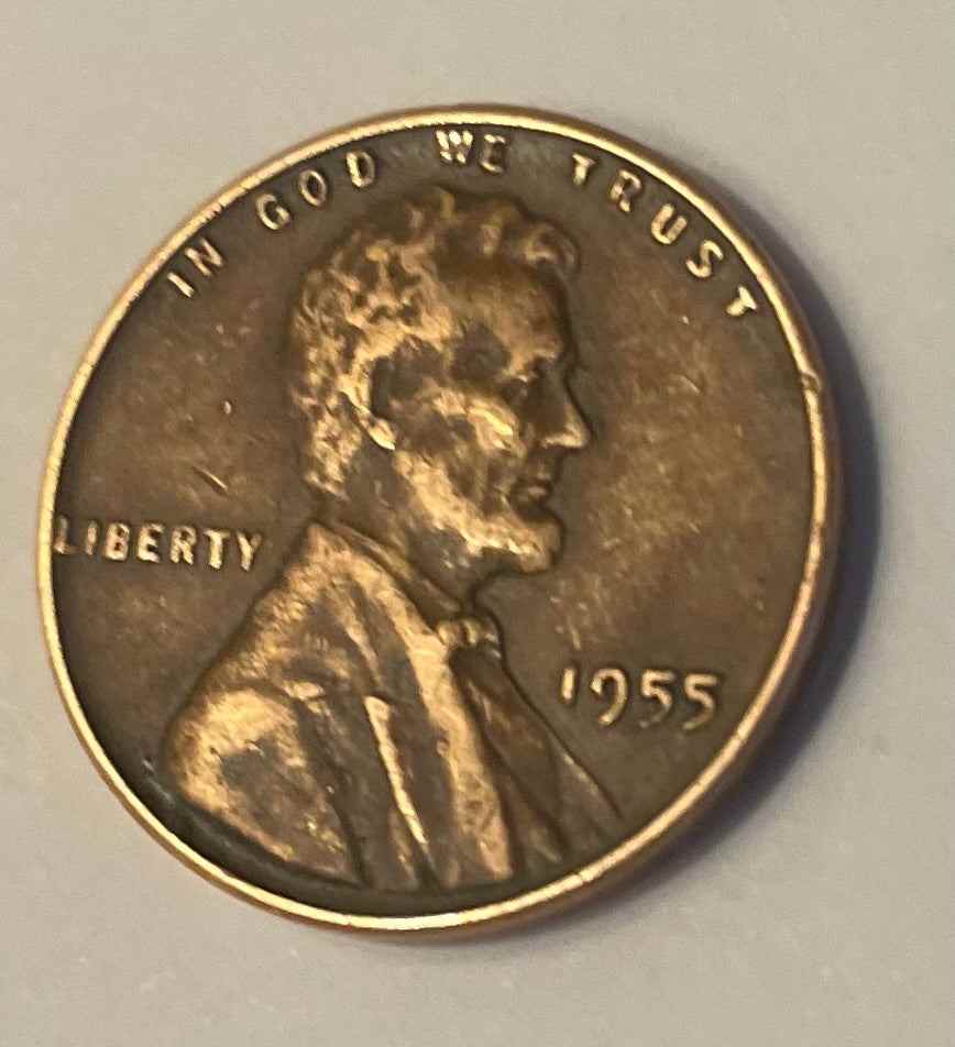 beautiful 1955 wheat penny with Lincoln's silhouette, auctioned on Rarity Rack