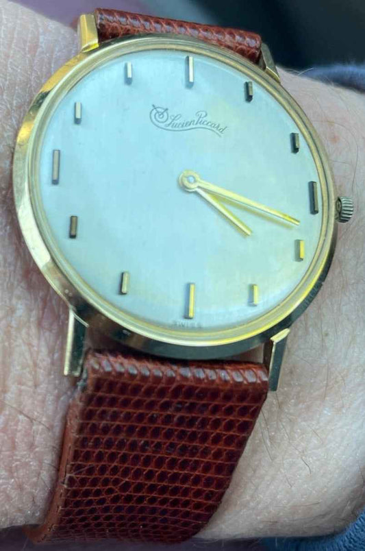 Vintage Lucien Piccard ultra slim 14k gold mechanical watch with analogue display.