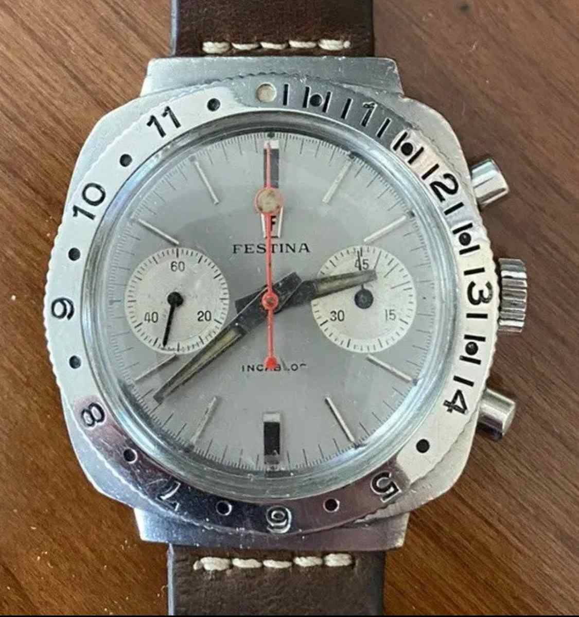 Vintage Festina Incabloc Chronograph Valjoux 7733 38mm watch with silver dial and leather band.