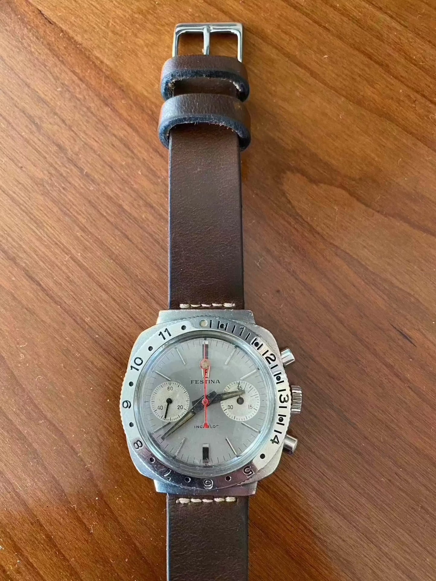 Vintage Festina Incabloc Chronograph Valjoux 7733 38mm watch with silver dial and leather band.
