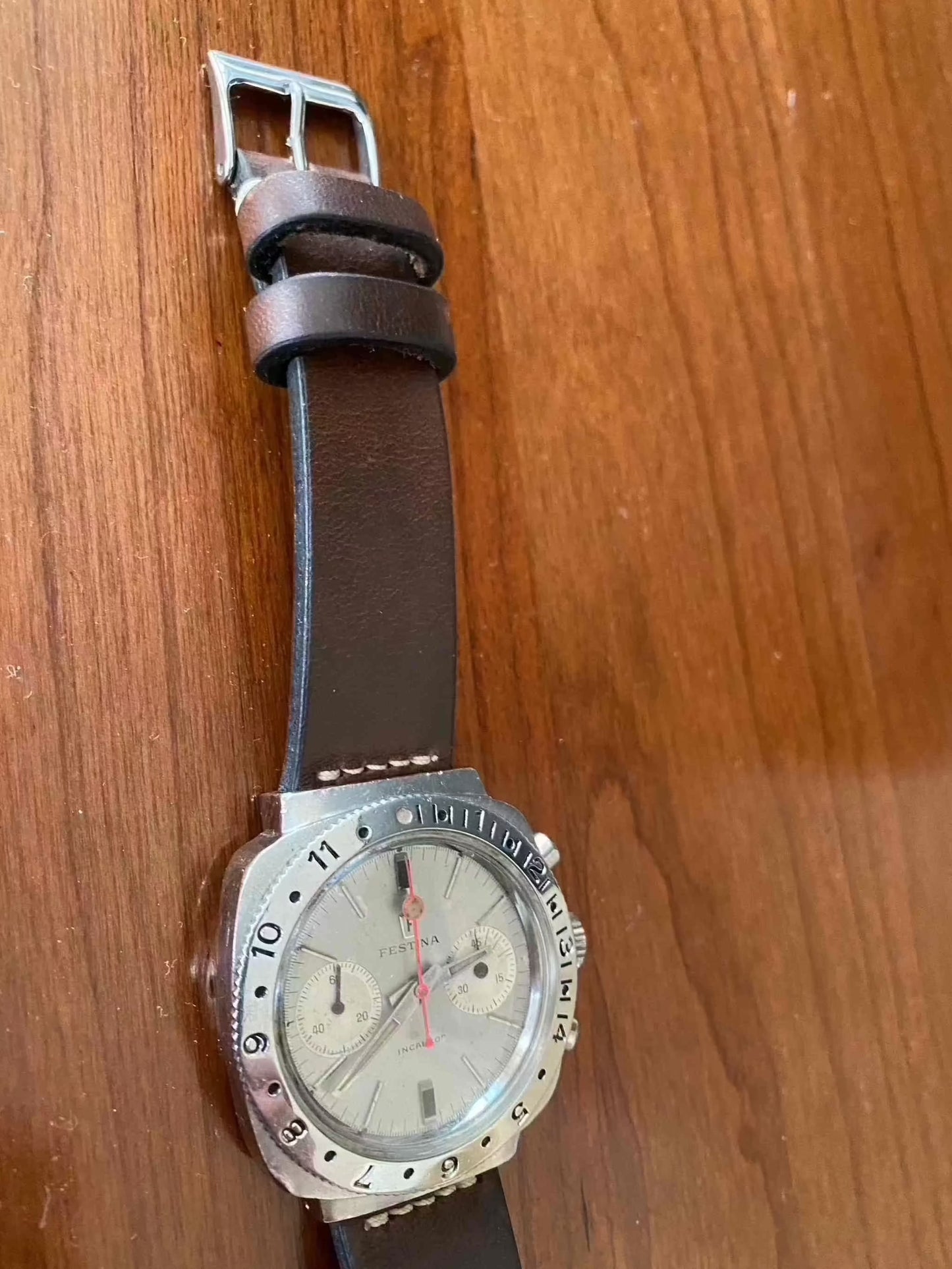 Vintage Festina Incabloc Chronograph Valjoux 7733 38mm Watch with silver dial and leather band.