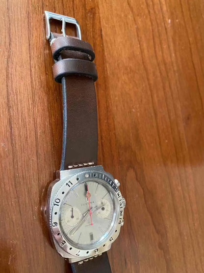 Vintage Festina Incabloc Chronograph Valjoux 7733 38mm Watch with silver dial and leather band.