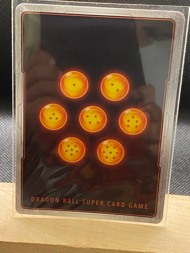 Masters Ultra Instinct Goku's Kamehameha card with alternate art foil design.