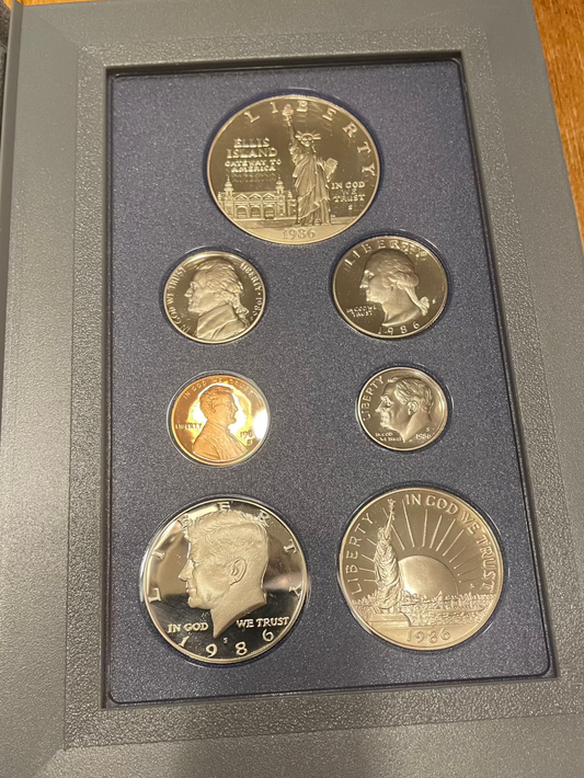 1986 United States Proof Prestige Set with 7 coins and Certificate of Authenticity.