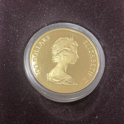 1982 RCM Canadian Constitution $100 Dollar 1/2 oz Gold Coin with Queen Elizabeth II portrait in case.