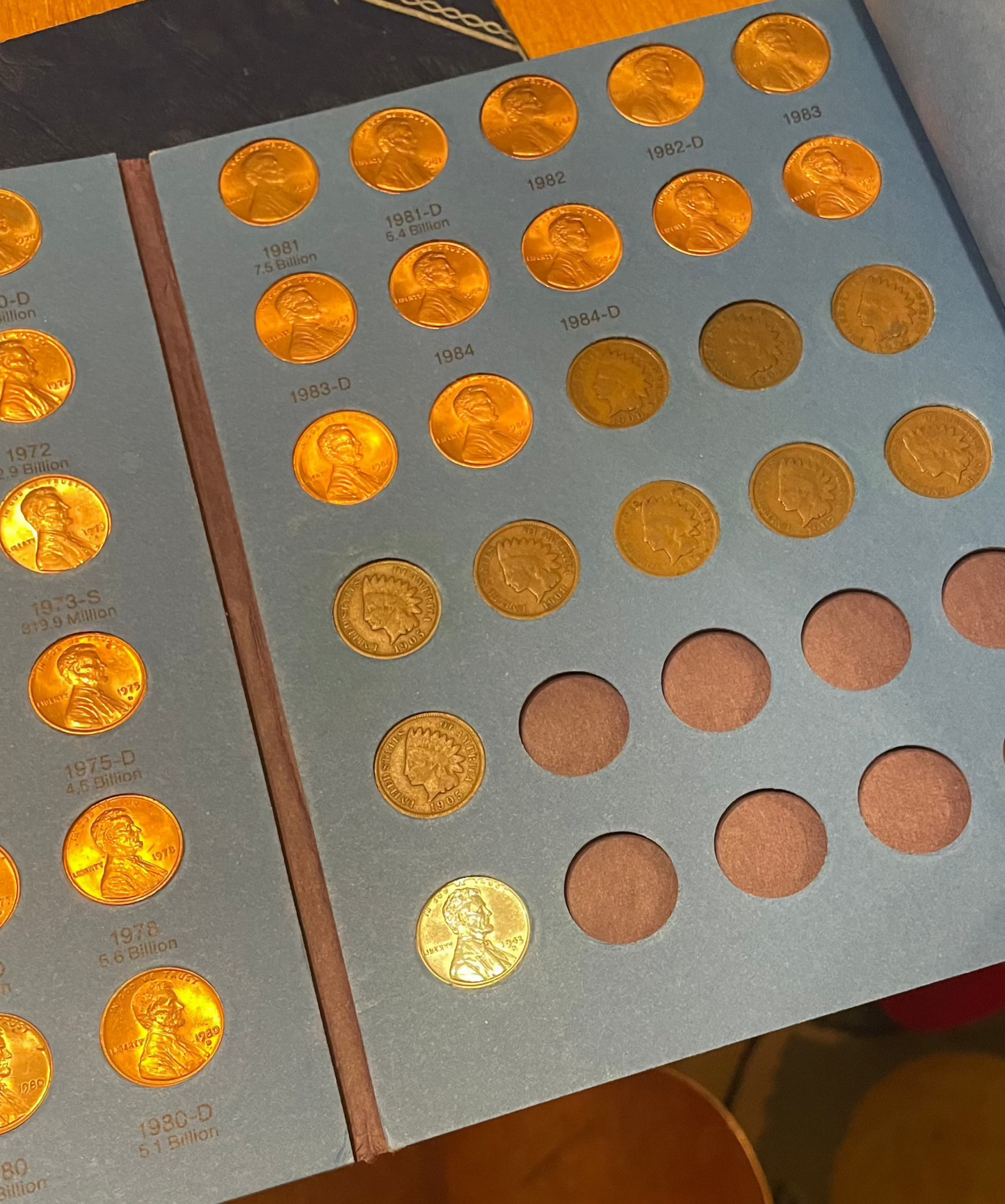 Collector's lot of four penny books with Indian Head pennies and near-mint 1943 steel cents bonus.