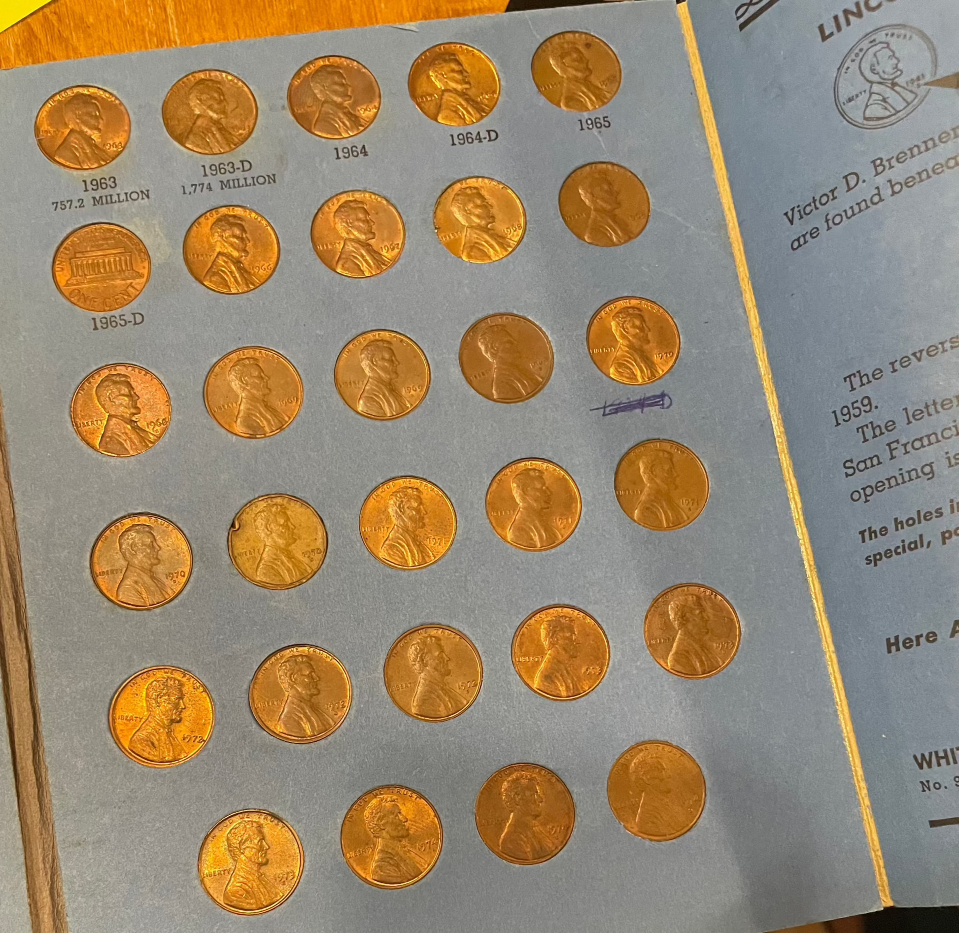 collector's lot penny book display with Lincoln cents and Indian Head coins